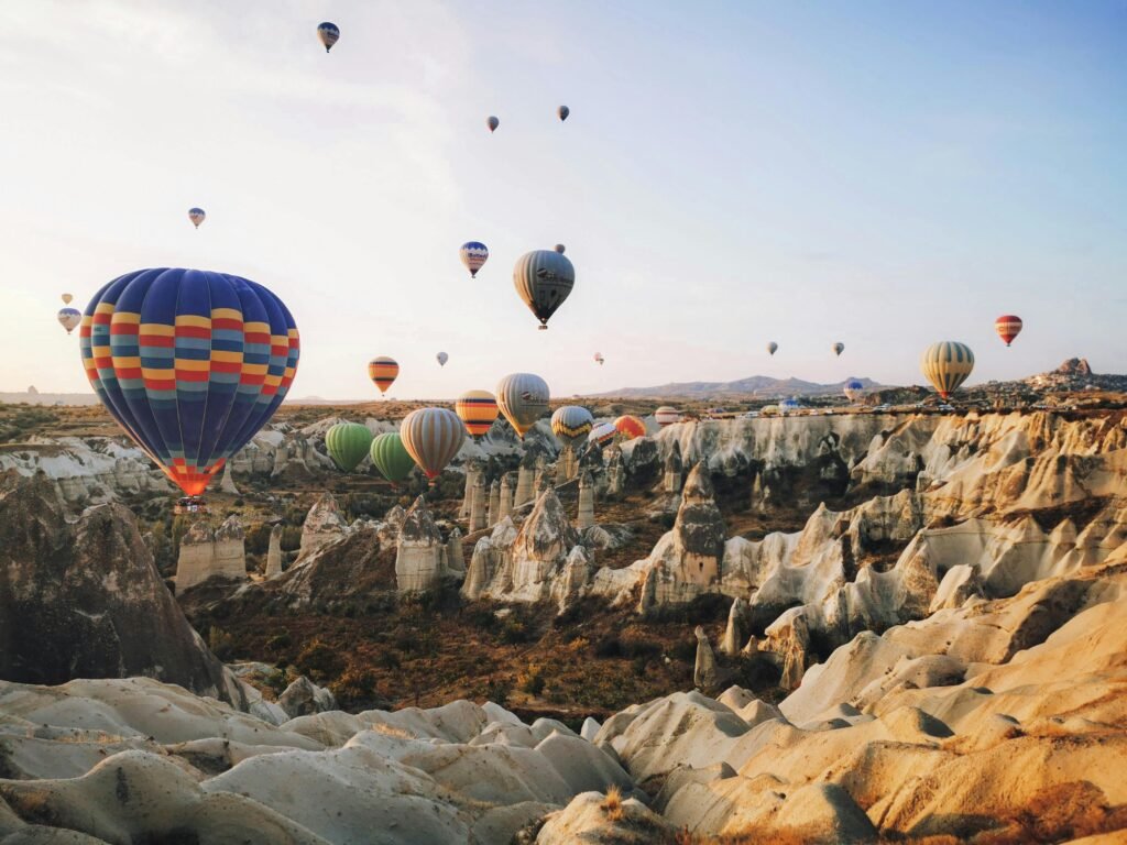 image-cappadocia-balloons.rful hot air balloons floating over the unique landscape of Cappadocia at sunrise