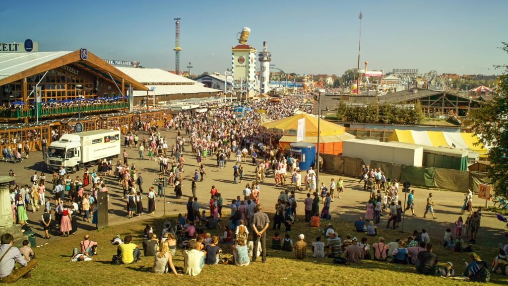 image-munich-oktob: Lively Oktoberfest celebration in Munich with traditional costumes and beer steins